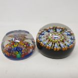 A Strathearn glass paperweight, with faceted sides and decorated with multi coloured canes, boxed,