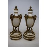 A pair of Louis XVI style marble and brass cassolettes, with rams face masks, 30 cm high (2)