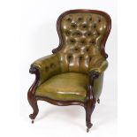 A Victorian mahogany armchair, with acanthus leaf carved arms and upholstered in green leather See