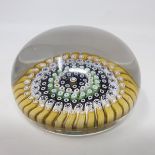 A Whitefriars Millefiore glass paperweight, with multi coloured canes and central star