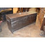 An 18th century oak six plank coffer, 105 cmn wide iron handles to both sides, hinges replaced,