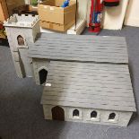 A doll's house, in the form of a church with an attached school room, 65 cm wide, with various