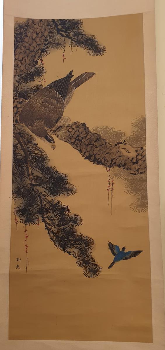 A Japanese painted hanging scroll, decorated with an eagle in a pine tree, signed, the image 93 cm x