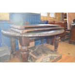 A Victorian oak oval extending dining table, inset two extra leaves, 238 cm wide