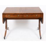 A 19th century mahogany sofa table, having two real and two false drawers, on end supports with