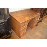 A stripped pine desk, having six drawers, 109 cm wide