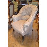 A late 19th century button back armchair, on cabriole front legs