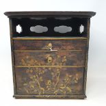 A Japanese table top chest, with black lacquered decoration, 21 cm wide RB General wear and rubbing,