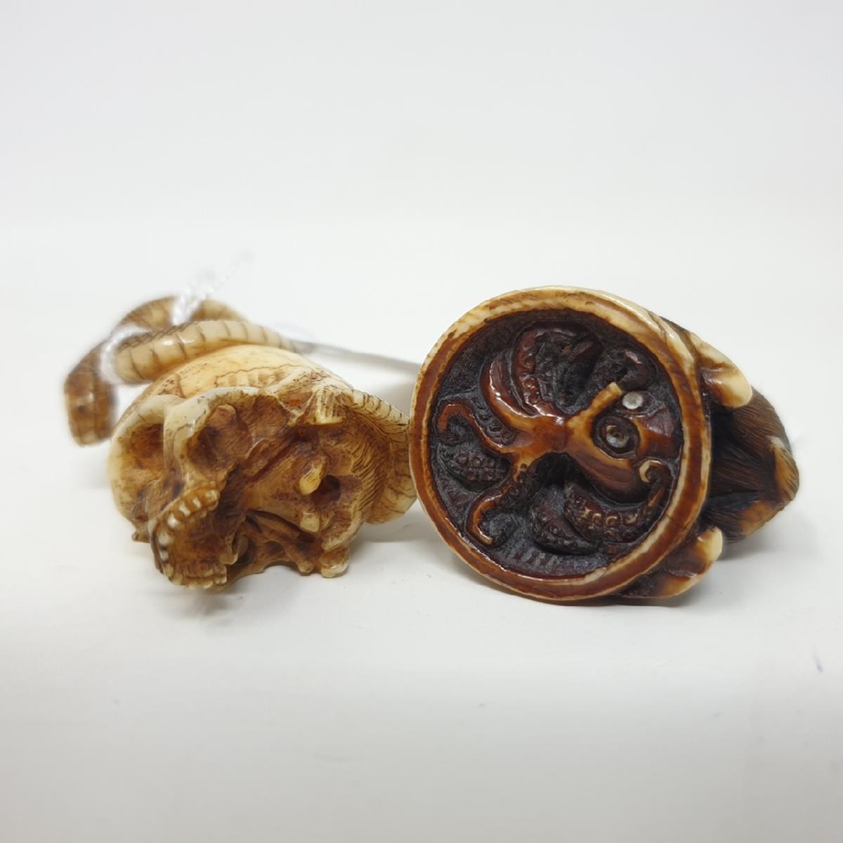 A Japanese carved and stained ivory netsuke, in the form of a monkey on a mound hiding an octopus, - Image 3 of 3