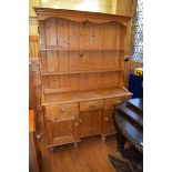 A stripped pine kitchen dresser, 136 cm wide base - 45 cm deep, 79 cm high