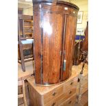 Five kitchen chairs, a 19th century bow front oak hanging corner cupboard, a stripped pine hanging