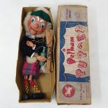 A Pelham puppet, McBoozle, with handkerchief and wooded bottle, in original brown box