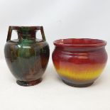 An art pottery twin handled vase, of baluster form, a Bretby vase, a Wardle pottery lamp base and