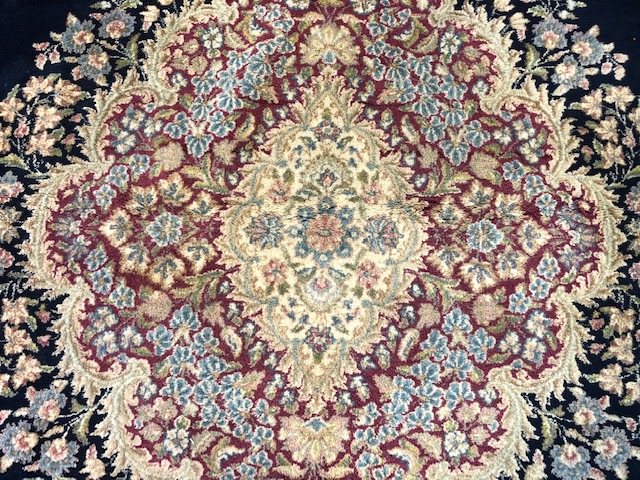 A large Persian carpet, with floral decoration on a blue ground, approx. 450 x 370 cm