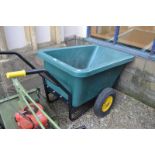 A large plastic wheelbarrow, 73 cm high