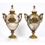 A large pair of marble cassolettes and covers, of ovoid form, the brass mounts decorated cherub face