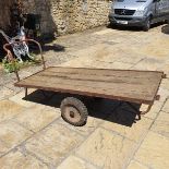 A large galvanised garden waterbutt, 66 cm high, and a garden trolley (2)