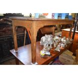 A Victorian elm farmhouse kitchen table, with a four plank top, with a frieze drawer, on square