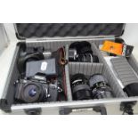 A Nikon F3 camera, with assorted lenses, in a case Please click on the lot number to see extra