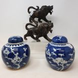 A pair of Chinese ginger jars and covers, decorated prunus, 14 cm high, a lacquered tea set, a