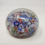 A Baccarat scrambled glass paperweight, with various latticino and coloured glass canes, 6.2 cm