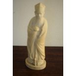 An early 20th century Chinese carved ivory figure, of a sage holding a staff, 19 cm high