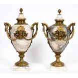 A large pair of marble cassolettes and covers, of ovoid form, the brass mounts decorated cherub face