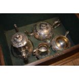 A Victorian silver plated four piece tea and coffee service, with embossed decoration, in a fitted