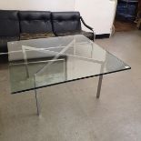 A Mies Van Der Rohe Barcelona table, the glass top on a chrome base, 100 cm square
