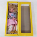 A Pelham puppet, Girl, in original yellow box, cellophane missing