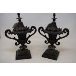 A pair of 19th century bronze urns and covers, decorated foliage, 23 cm high (2)