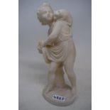 A carved alabaster group, of a putto and a cat, 28 cm high