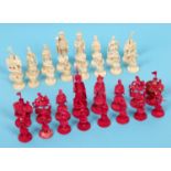 A 19th century Chinese export ivory chess set, with red stained Chinese characters, the natural