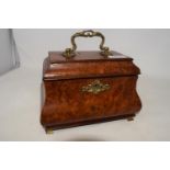 A 19th century bombe tea caddy, veneered in burr wood, the interior with three brass canisters, 22.5