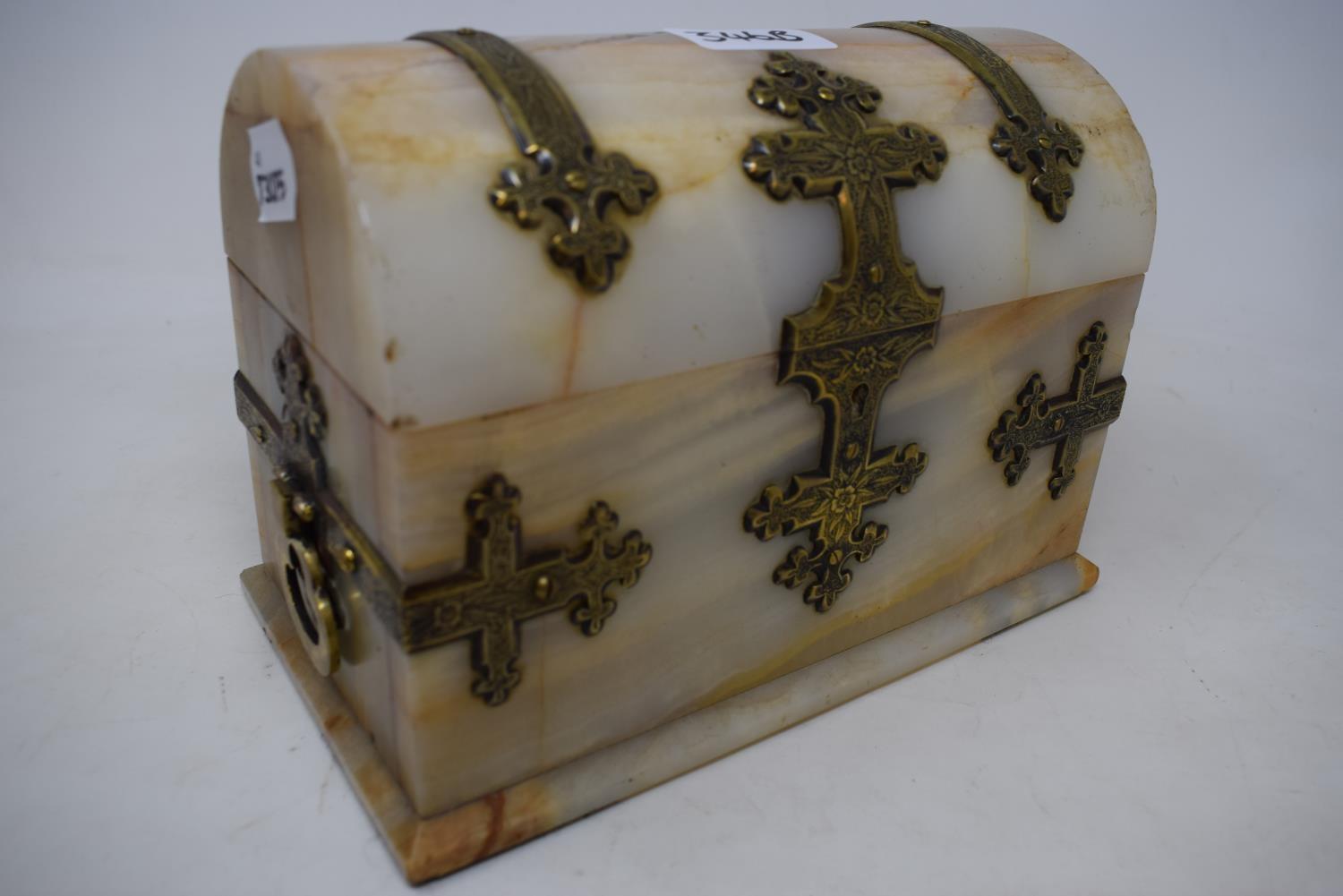 A Victorian onyx dome top casket, the brass strapwork with engraved decoration, 22 cm wide