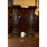 A large pair of Japanese bronze vases, decorated birds, flowers and foliage, 64 cm high