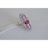 A platinum elongated ring set with rubies, approx. 0.97ct, and diamonds, approx. 0.73ct