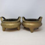 A pair of Chinese brass censors, with loop handles and seal type marks, 23.5 cm wide x 15.5 cm high