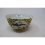 A Chinese porcelain medallion bowl, decorated vignettes of mountain scenes on a yelllow ground