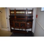 A late 19th century Aesthetic Movement walnut, ebonised and painted side cabinet, the raised back