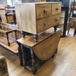 An oak gateleg table, on baluster turned supports, 151 cm wide, and a low chest, of three drawers,
