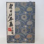 A Chinese artists concertina book, with animal and other illustrations cover with corners knocked/