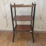 An ebonised three tier etagere, inlaid with amboyna and crossbanded, 45 cm wide Report by RB One