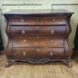 An early 19th century Dutch oak bombe chest, of four graduated long drawers, with claw and ball