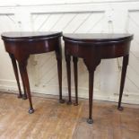 A pair of early 18th century style D shaped tea tables, on tapering legs with pad feet, 60.5 cm wide