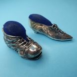 Two silver shoe pin cushions