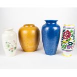 Four Poole Pottery vases including a blue iridescent baluster vase, a gold iridescent swollen