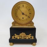 A Regency timepiece, the 9 cm diameter brass dial with Roman numerals, fitted an eight day movement,