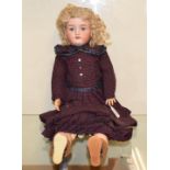 A Handwerck bisque head doll, with sleeping blue eyes, impressed Handwerck 4½, on a composition