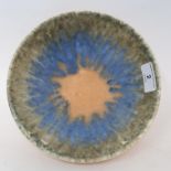 A Ruskin crystalline pottery bowl, internal with striated green, blue and orange glazes, with